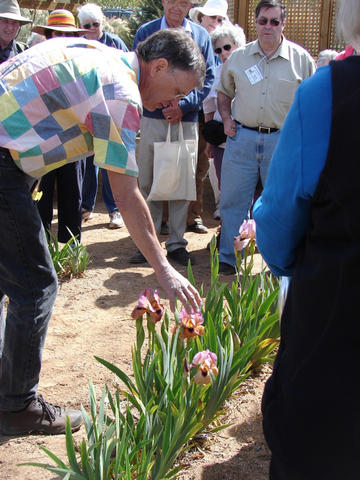 Photo of Lowell Baumunk with 'Refiners Fire' by Cindy Rivera